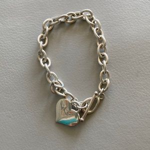 Pretty small silver  charm bracelet with heart